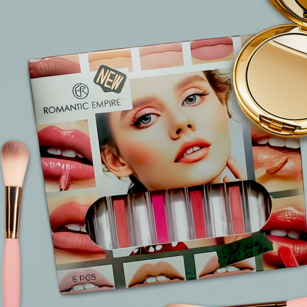 Makeup palette with lip swatches and a compact mirror on a light gray background